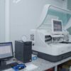 High-tech laboratory equipment with computer system in lab setting.